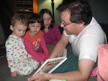 Father reading children a story