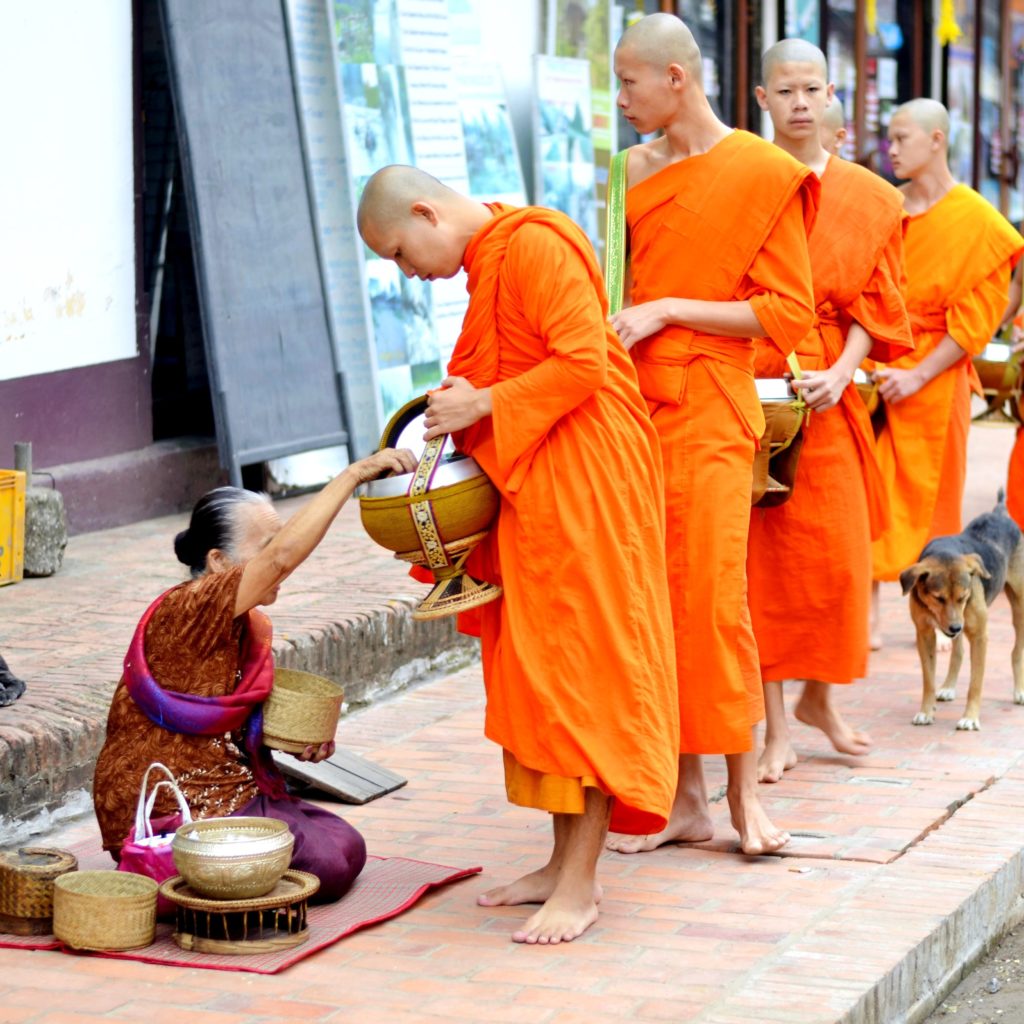 Four monks standing in line
