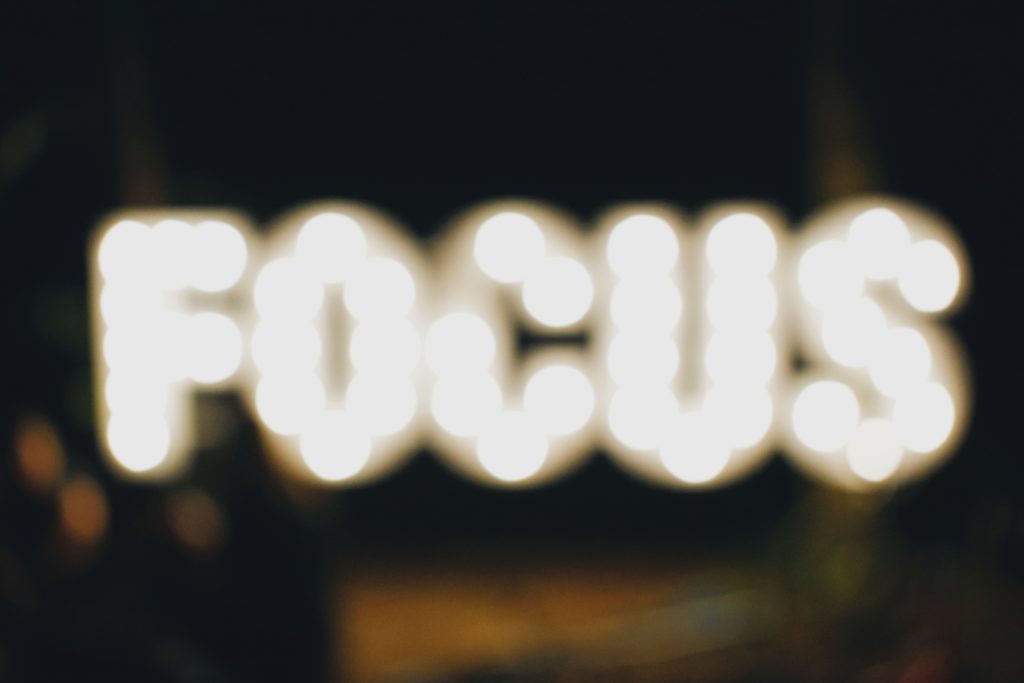 The word focus out of focus illuminated by lights