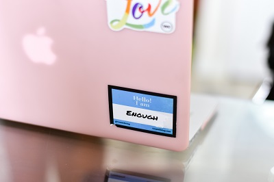 Pink laptop with stickers
