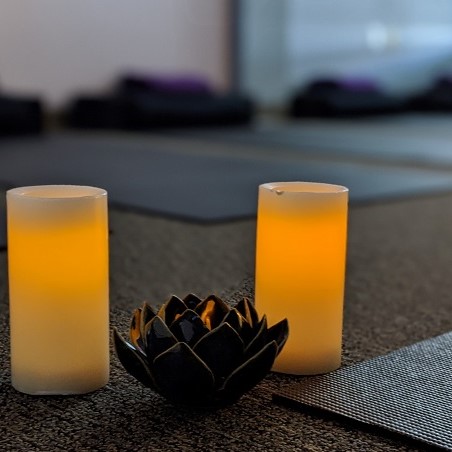 Lotus flower bowl between two candles