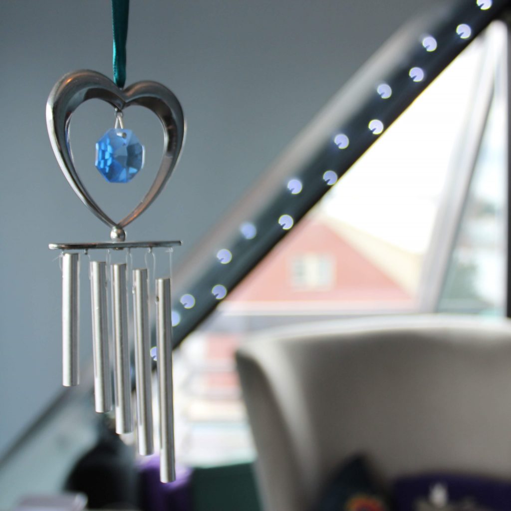Silver wind chime with blue crystal