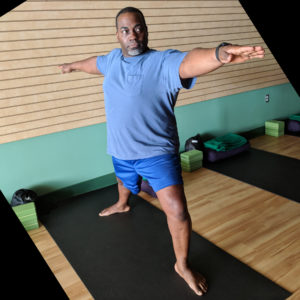 Man posing on a yoga mat
